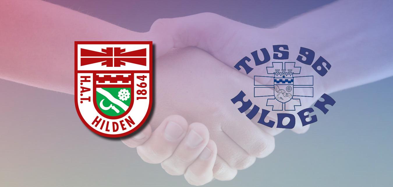 H&auml;ndedruck zwischen zwei Personen, mit Logos von HAT Hilden und TuS 06 Hilden im Hintergrund.