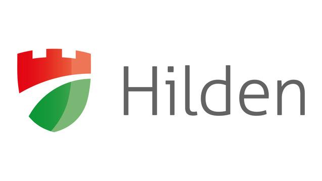 Logo der Stadt Hilden mit einem roten Wappen und dem Schriftzug &bdquo;Hilden&ldquo; in grauer Schrift.